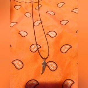 Black cord necklace with wing charm